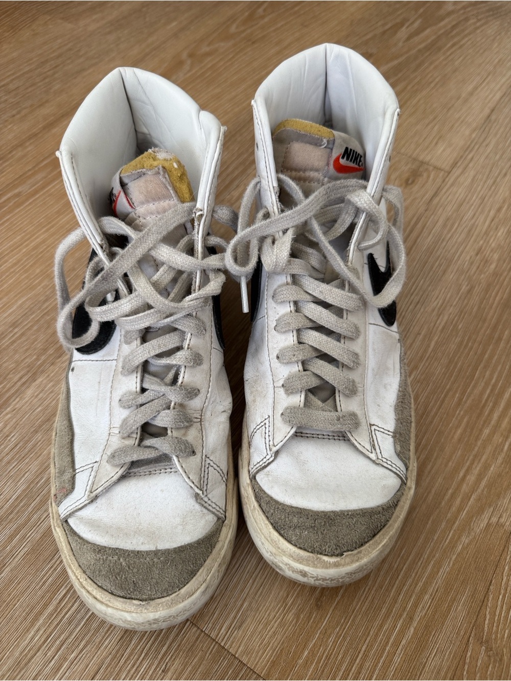 Nike White/Gray High-Top Sneakers with Black Swoosh and Red Tongue Accent